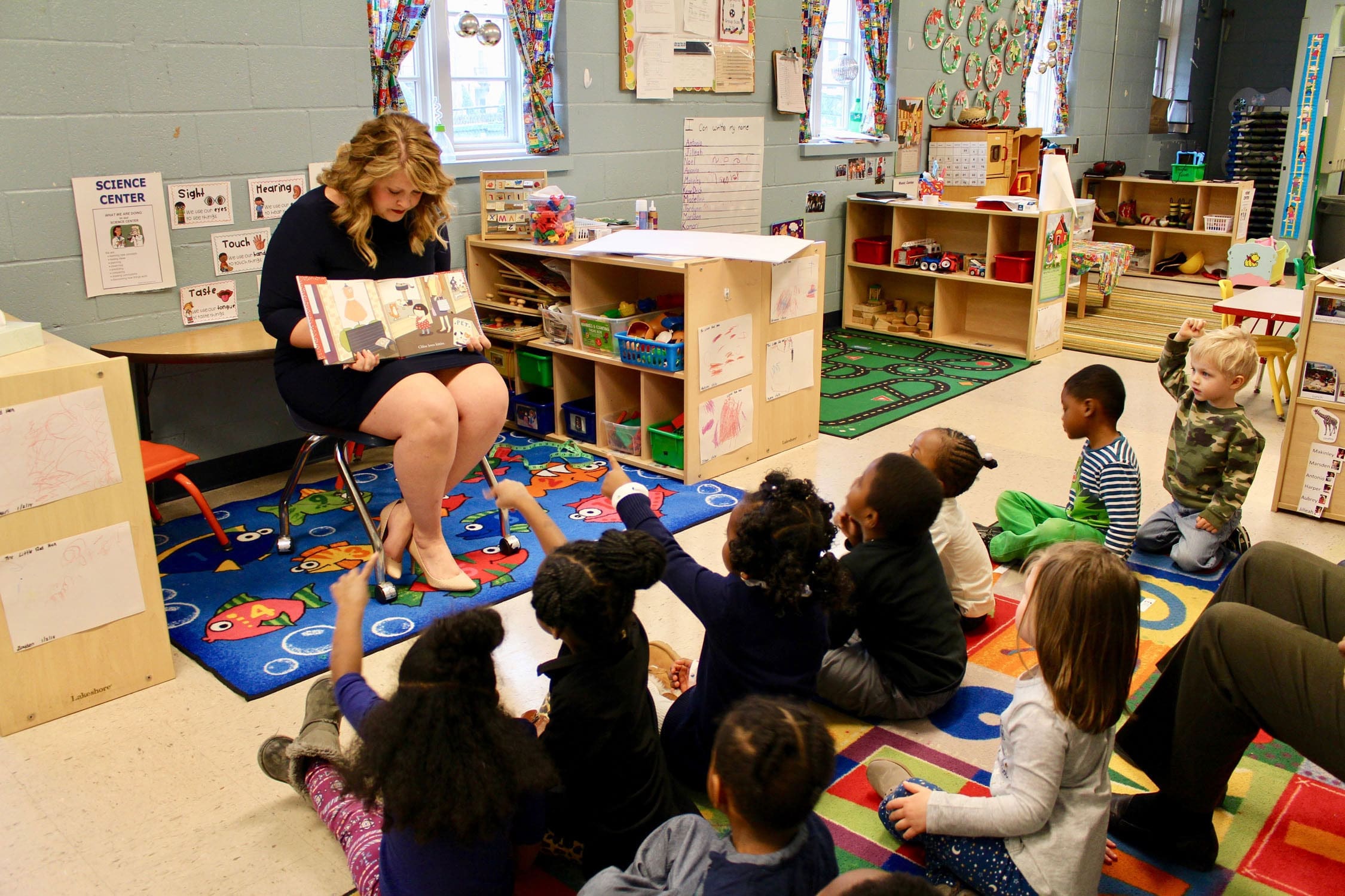 Volunteer reading to children