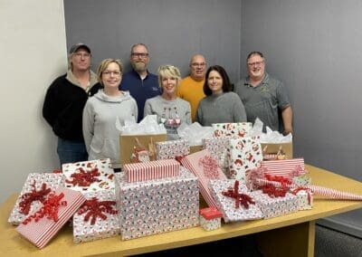 graphic packaging team with gifts for adopt a family