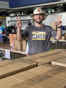 Corporate team member volunteering at 2025 stuff the bus