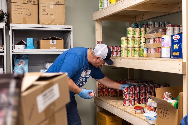 stocking shelves at a food bank